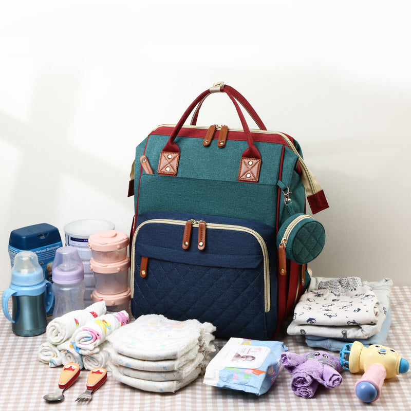TravelNest – Zawsze miejsce do odpoczynku – torba na pieluchy 2 w 1 z łóżeczkiem dla dziecka